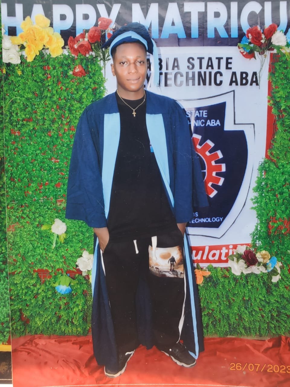 Scholarship beneficiary in matriculation gown