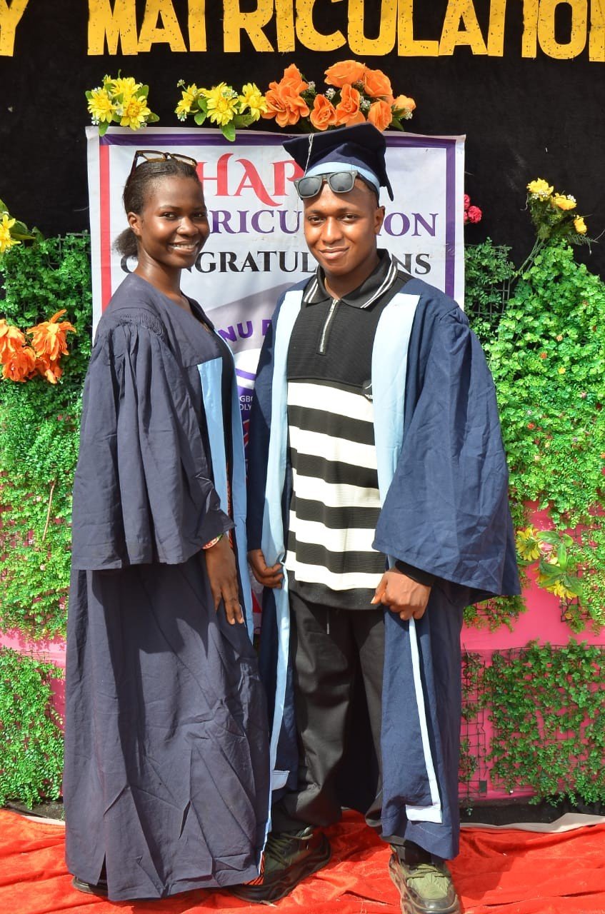 Two scholarship beneficiaries in matriculation gowns
