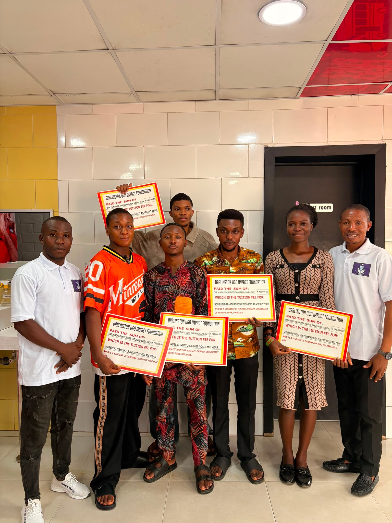 Students holding their tuition fee awards